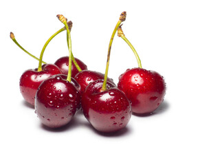 Juicy cherries in water droplets on a white background. Useful food. Beautiful berries isolate. Ripe berries on the table. Ingredient for a dish.