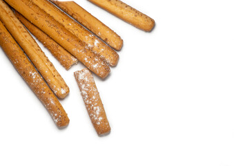 Sesame biscuits on a white background. Biscuits are elongated in the form of sticks. Bread products. Flour products. Healthy food.
