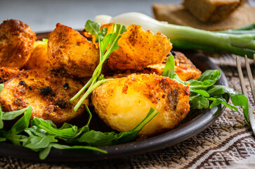 Homemade baked potatoes cooked in the 