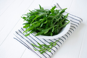 fresh herbs arugula on a wooden table