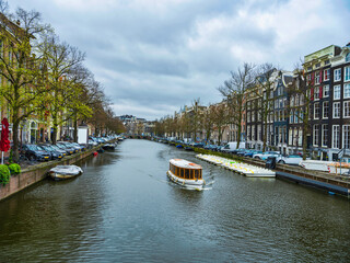 Amsterdam canal and dutch buildings in Netherlands