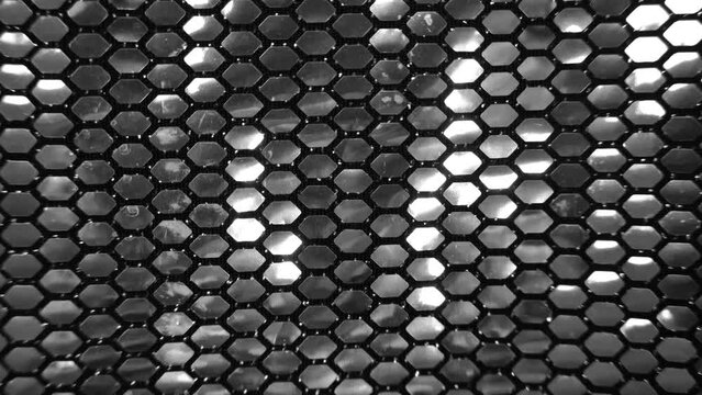 Metallic silver shinny sequin pattern texture bg, black and white, honeycomb shape, flashing light