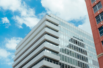 modern office building with sky clouds miami downtown  