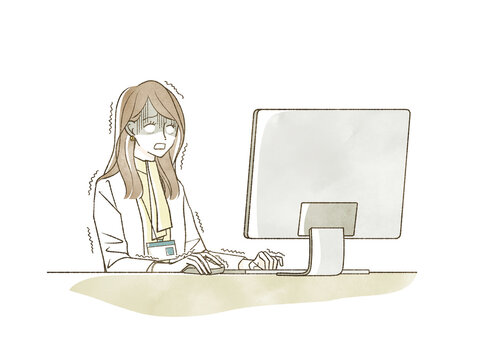 仕事をしながら青ざめている女性