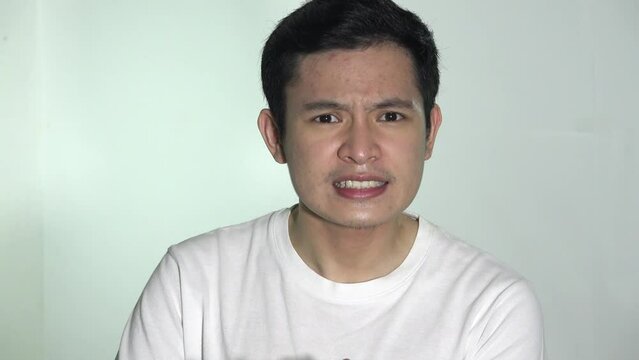 An Angry Asian Male Complaining Isolated