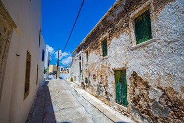 Fototapeta na wymiar Architectural buildings walking by the the streets of Chora village in Kythira island , Greece. Urban photography of the picturesque Chora village in Kythera island.