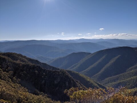 Australian Mountain Majesty: Captivating View of a Serene Valley Nestled Amidst Peaks