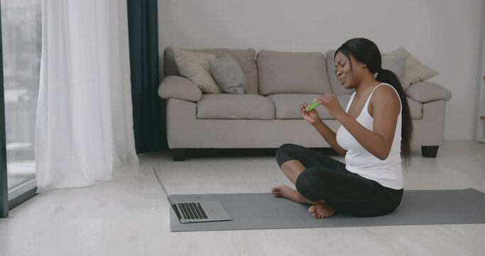 Black woman having video call on laptop