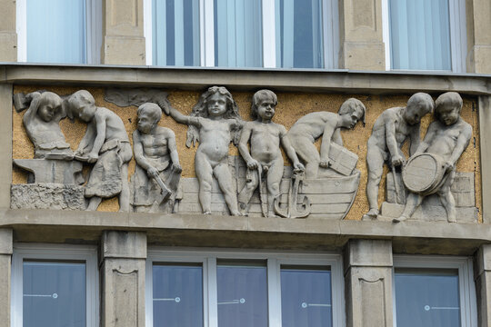 Lviv, Ukraine - June, 2022: PROSP. SHEVCHENKA, 17-19 &ndash; The prosecutor's office in Lviv region. Inserts with high-relief depictions of trade and crafts allegories (Wojciech Przedwojewski, 1908)