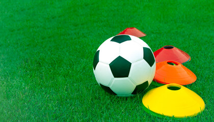 Obraz premium soccer school , football training cone with ball 