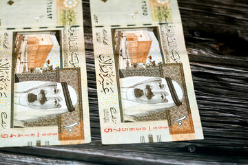Obverse side of Saudi Arabia 10 SAR ten Saudi riyals cash money banknote with the photo of king...