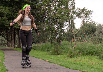 young sporty woman practicing inline skating in an urban setting