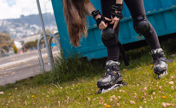 young sporty woman practicing inline skating in an urban setting