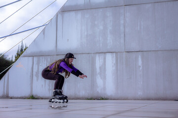 young sporty woman practicing inline skating in an urban setting
