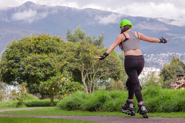 young sporty woman practicing inline skating in an urban setting
