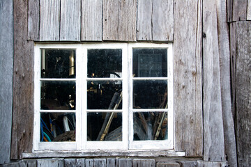 Obraz na płótnie Canvas old wooden window in shed