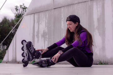 young sporty woman practicing inline skating in an urban setting