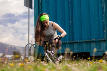 young sporty woman practicing inline skating in an urban setting