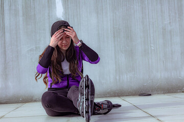 young sporty woman practicing inline skating in an urban setting
