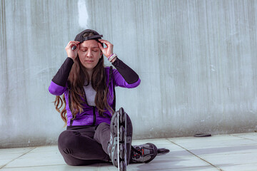 young sporty woman practicing inline skating in an urban setting