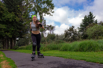 young sporty woman practicing inline skating in an urban setting. High quality photo
