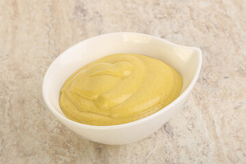 Organic mustard sauce in the bowl