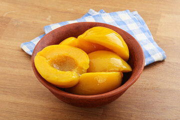 Sweet canned peaches with syrope