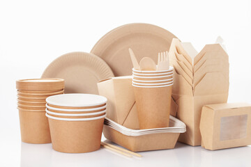 Eco craft paper tableware. Paper cups, dishes, bag, fast food containers and  wooden cutlery on...