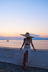 Beautiful girl tourist walking in the streets of Hydra, Greece