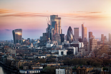 Fototapeta premium Sunrise view of the City of London with the skyscrapers reflecting the soft sunlight, England