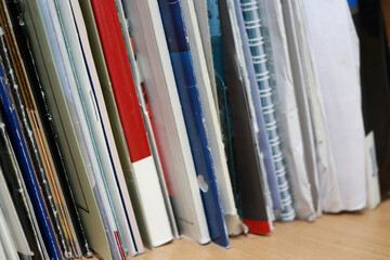 Stacks or rows of books, magazines, journals and newspapers in a library