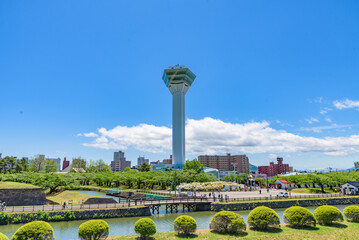 Goryokaku Tower in spring sunny day  bule sky. The tower observatory decks command the entire view of Goryokaku Park, the beautiful star shaped fort. Hakodate City, Hokkaido, Japan.