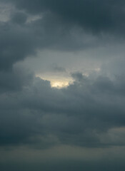 In the evening, the sky was very thick with many clouds. The clouds enclosed the sky as if there was a new world behind them, and the layers of clouds were spectacular.