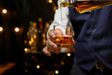 Bartender pouring Whiskey, on  bar,