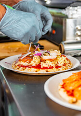 hand of chef baker making mini pizza at kitchen. The process of making pizza. cooking italian pizza