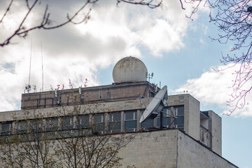 industrial building with radar and satellite antenna