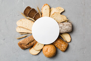 Minimalist paper blank mockup on background of Types of homemade bread. Different kinds of fresh...