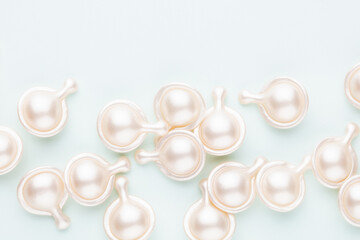 Hyaluronic acid capsule on pastel background.