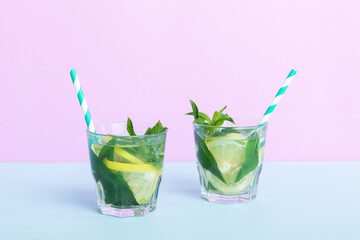 Mojito summer refreshing cocktail with ice and mint. mojito cocktail with lime, lemon and mint in a tall glass with a stick