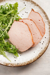 Traditional oven baked bavarian meal leberkäse sliced - meat dish made of corned beef, pork and...