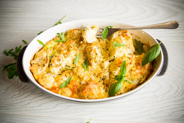 baked cauliflower with vegetables and cheese and scrambled eggs