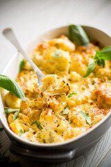 baked cauliflower with vegetables and cheese and scrambled eggs