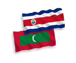 National vector fabric wave flags of Republic of Costa Rica and Maldives isolated on white background. 1 to 2 proportion.