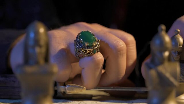 War strategy.
Making plans. Historical soldiers. Chess game. Antiquated map. Green embroidered historical ring detail.
