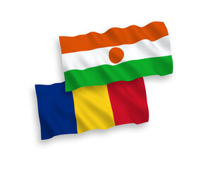 National vector fabric wave flags of Romania and Republic of the Niger isolated on white background. 1 to 2 proportion.