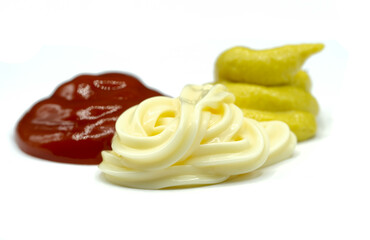 Ketchup, mayonnaise and mustard isolated on white background