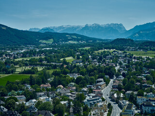 Fototapeta na wymiar Top view of a residential area of Salzburg and hills in the background, Austria