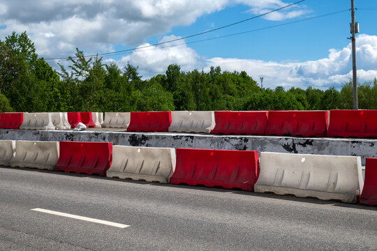 Water-filled barriers stand along the road during repairs in Moscow, Russia