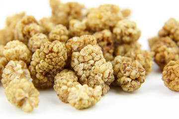 Dried mulberry on white background. Dry sweet berries morus alba