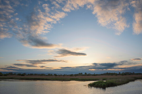 Stunning landscape sunset image of Somerset Levels wetlands in England during Spring